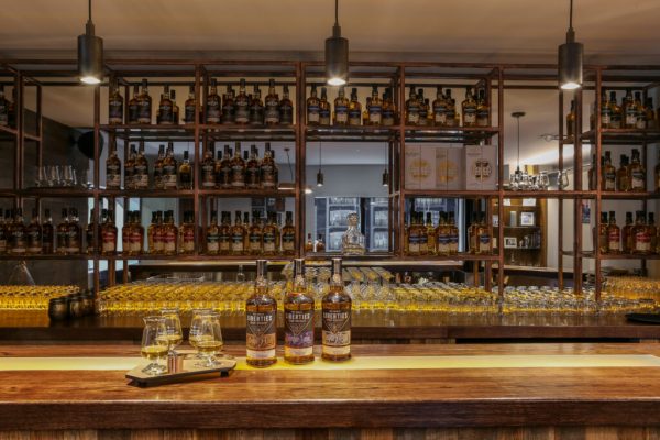 blenders room with liberties whiskey bottles on bar