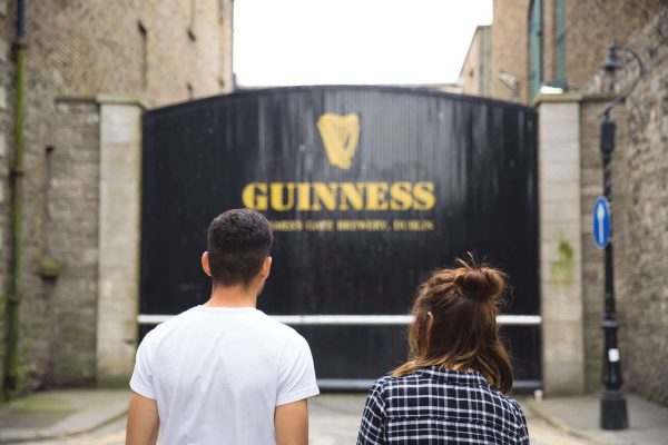Couple visting the famous Guinness Gate at Guinness Storehouse, St James Gate, Dublin 8