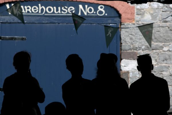 silhouette of people outside warehouse no.8